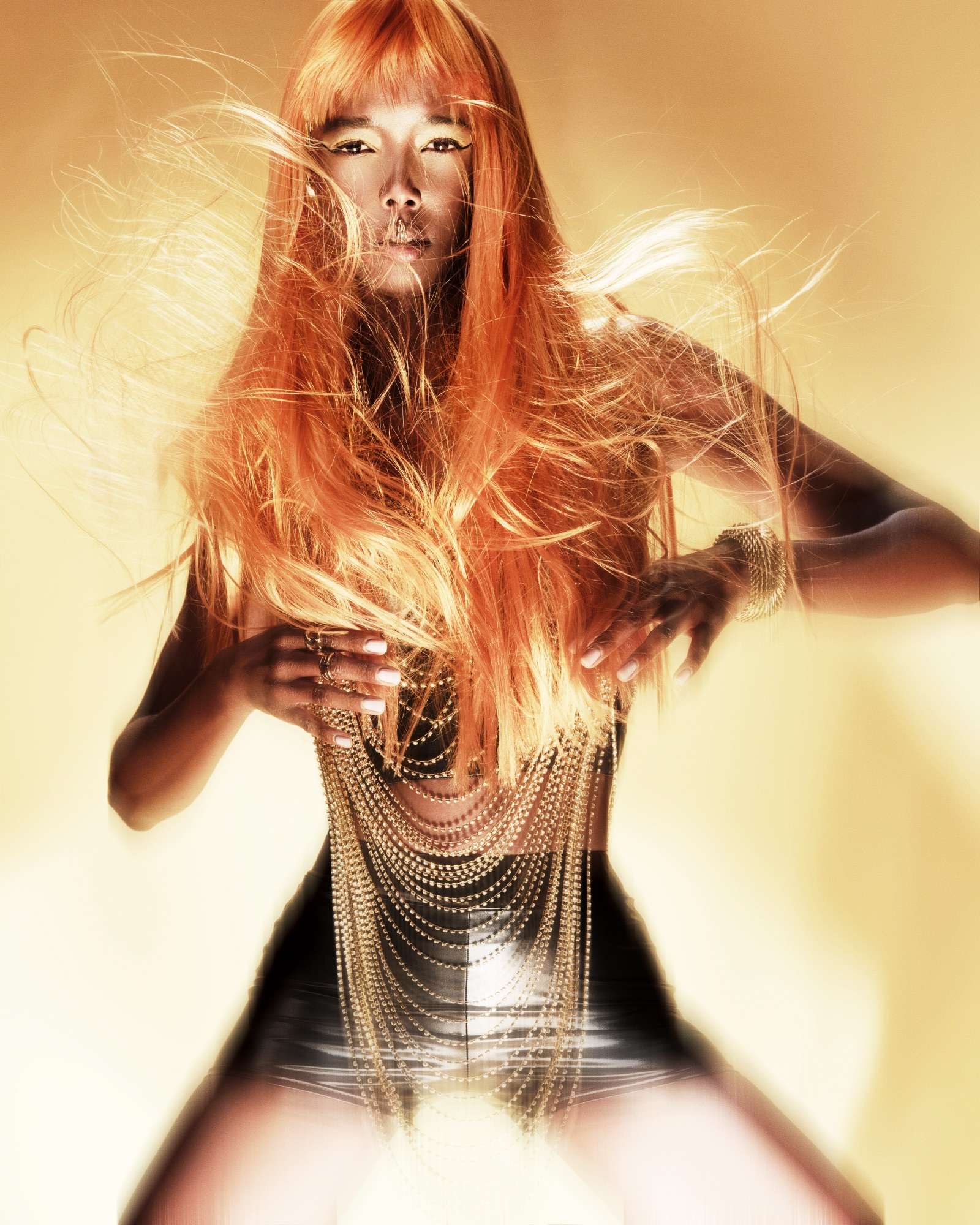 Copper Light collection Copper Light collection: model with long copper hair swept by wind, gold light